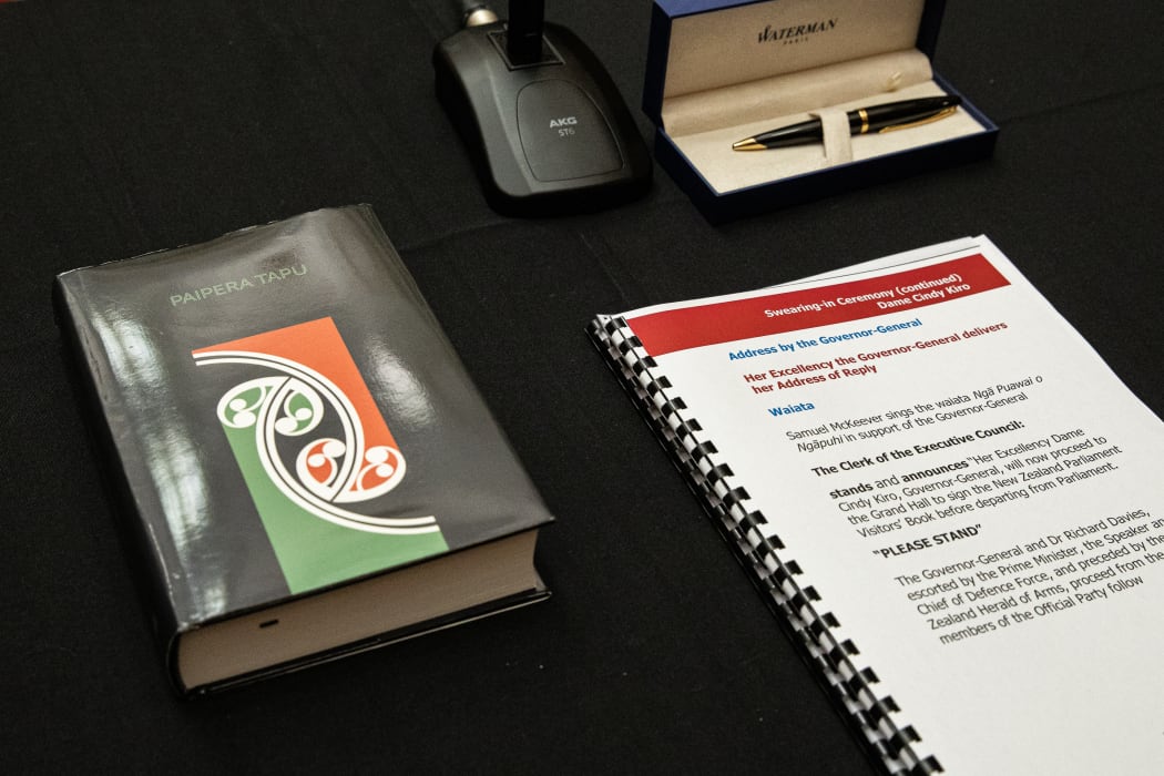 The tools of the oath lie waiting, a pen, a Bible in Maori and the necessary words.