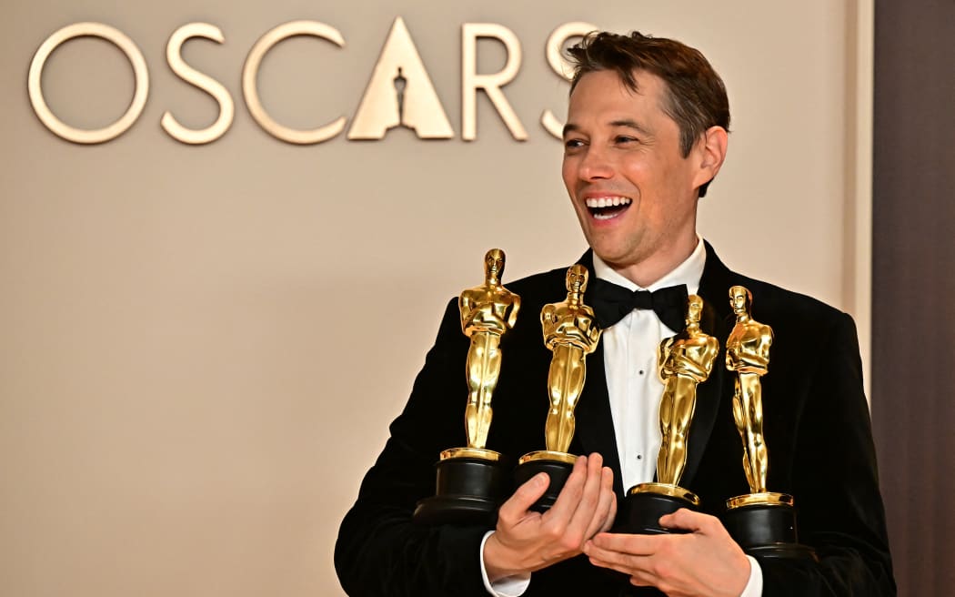 US producer Sean Baker poses in the press room with the Oscars for Best Film Editing, Best Original Screenplay, Best Director and Best Picture for "Anora" during the 97th Annual Academy Awards at the Dolby Theatre in Hollywood, California on March 2, 2025. (Photo by Frederic J. Brown / AFP)