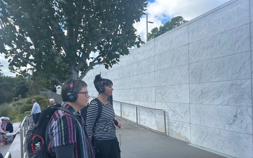 UC Arts Digital Lab manager Kaspar Middendorf and Our Stories director Kris Herbert test the Earthquake Stories Walk, which was developed to bring the CEISMIC audio archive to life in the central city.