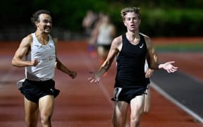 15 yr old track athlete Sam Ruthe becomes the youngest person ever to break the magic 4 minute mile barrier as pace setter Sam Tanner looks on. Wednesday night at Mt Smart Stadium 19 March 2025. Photo: Andrew Cornaga / Photosport