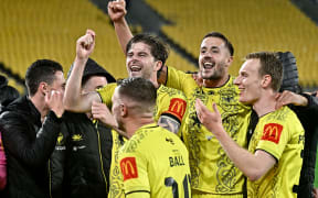 Phoenix players react to their win in the A-League, 2024