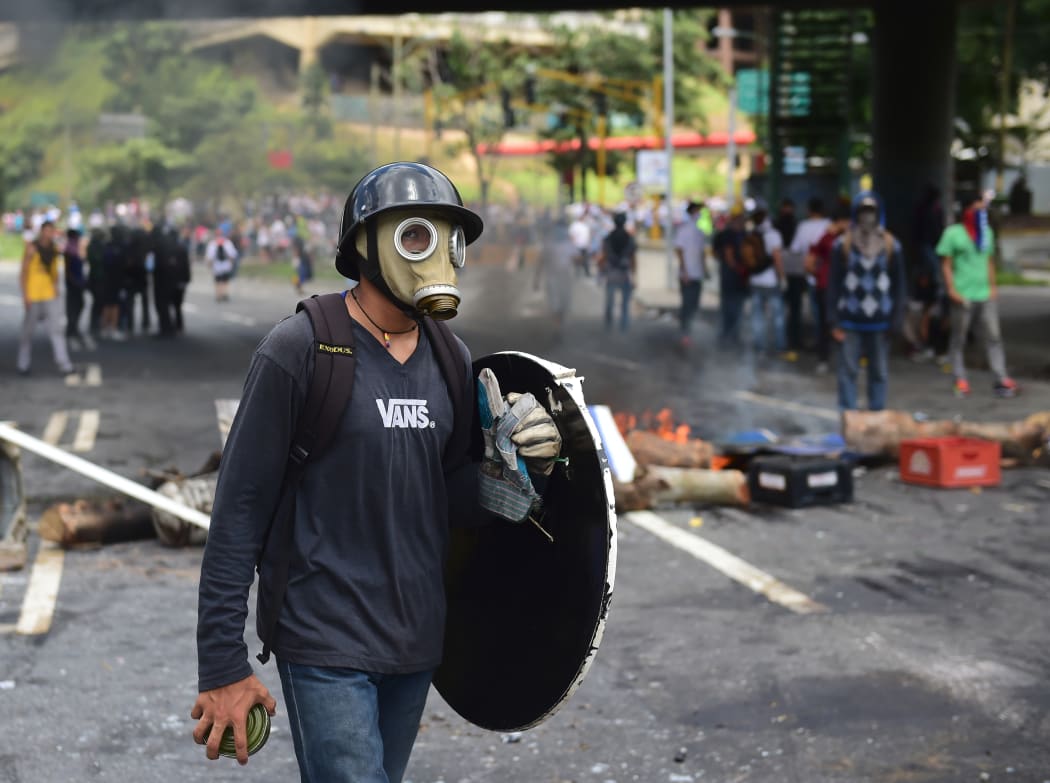 Protesters set up barricades in Caracas.