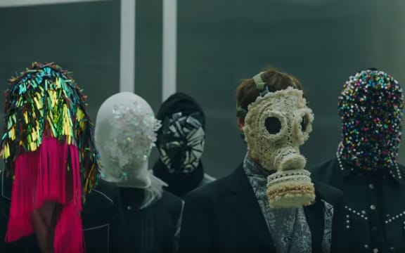 A popular South Korean boy band has caused controversy by using a Māori karakia at the start of its new pop song.