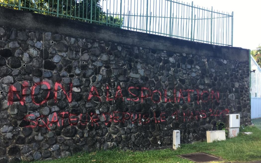 Graffiti against 'expropriation and squatting'outside Chinese consulate