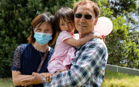 Lily Gao with her daughter Elysse and Gregory Kim.