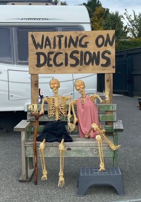 Lynn and Art Noanoa got so sick of waiting for council decisions, they installed two skeletons outside their home.