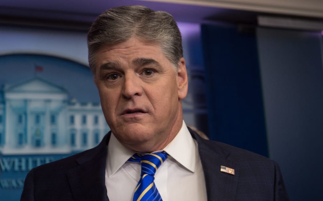 Fox News host Sean Hannity is seen in the White House briefing room in Washington, DC, on January 24, 2017. / AFP PHOTO / NICHOLAS KAMM