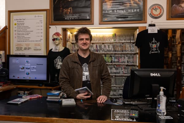 Staff member Tom Hutchison at Aro St Video Shop.