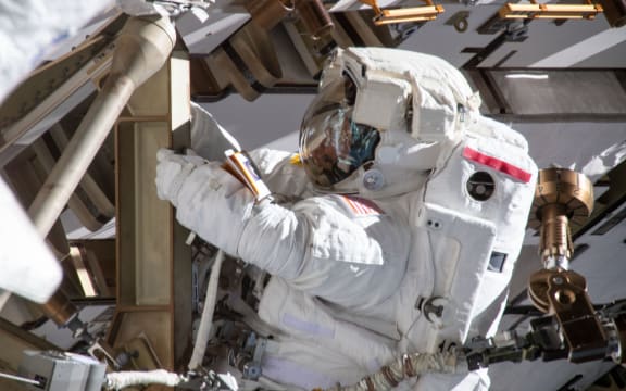 Astronaut Anne McClain working on the International Space Station's Port-4 truss structure during a six-hour, 39-minute spacewalk to upgrade the orbital complex's power storage capacity.