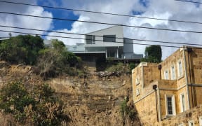A Shore Road property in the Auckland suburb of Remuera after a slip due to Cyclone Gabrielle. Some homes in the area have been looted, according to locals.