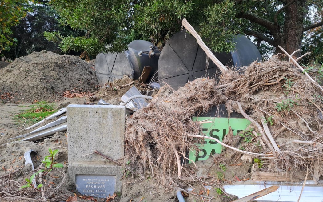 Debris brought down in the flood, and the marker for the flood level in 1938.