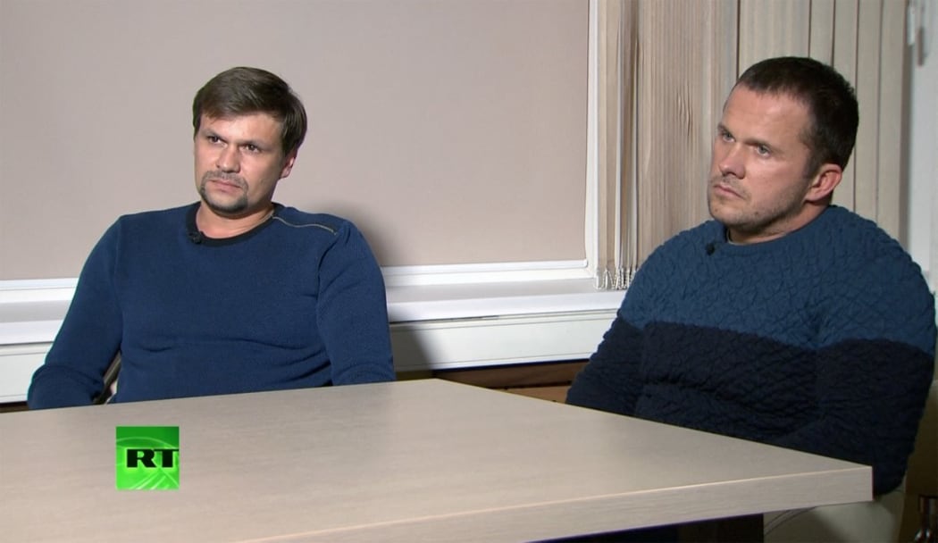 Ruslan Boshirov, left, and Alexander Petrov listen to a question during the interview to Margarita Simonyan, the editor-in-chief of the RT broadcaster and Rossiya Segodnya International Information Agency, in Moscow, Russia, September 13, 2018.