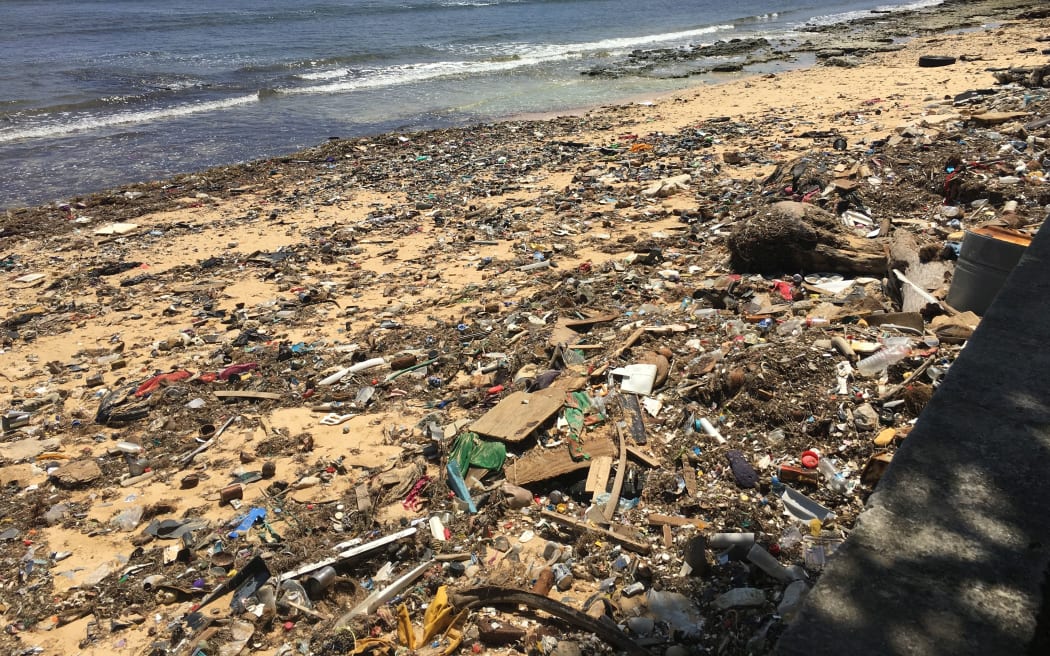 Garbage mingled with brown algae is strewn along ocean side beaches in Majuro, the capital of the Marshall Islands. Recent Marshall Islands EPA water quality testing showed that 90% of the ocean and lagoon areas examined were unsafe for swimming or fishing.