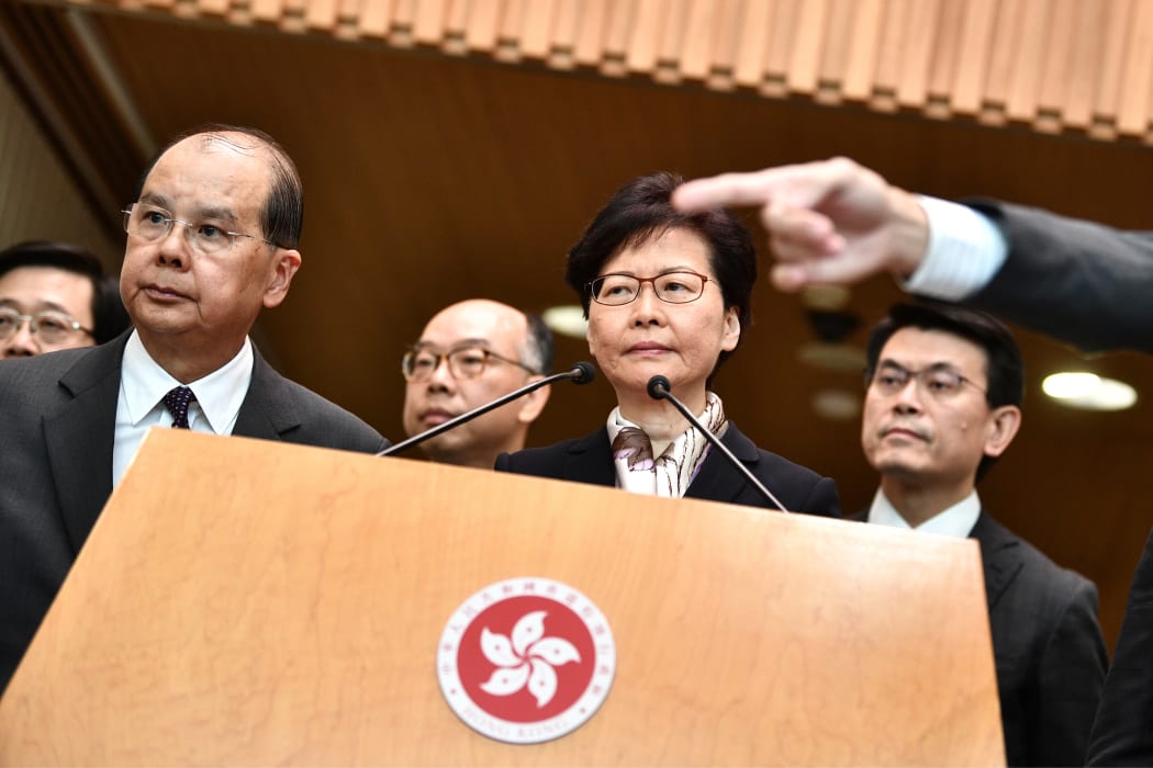 Hong Kong Chief Executive Carrie Lam (C) listens to a question during a press conference in Hong Kong.