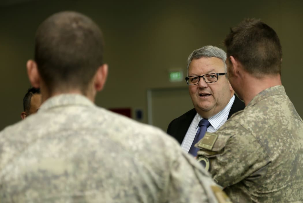 Troops returning from Iraq are welcomed by Defence Minister Gerry Brownlee at Ohakea Air Base on 16 November 2015.