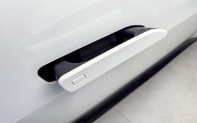 Hidden door handles showcased at Avatr Automotive Experience Center in Yangzhou, Jiangsu, China on November 4, 2025. (Photo by Chen Yang / CFOTO via AFP)