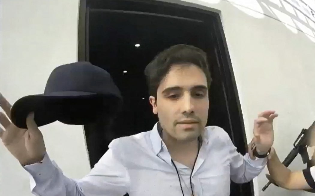 (FILES) Grab from a handout video released by the Mexican Government's Production Centre for Informative and Special Programmes (CEPROPIE) during the morning press conference of Mexican President Andres Manuel Lopez Obrador on October 30, 2019, showing the moment of the arrest of alleged trafficker Ovidio Guzman, son of jailed drug kingpin Joaquin "Chapo" Guzman, on October 17, 2019. Mexico extradited Ovidio Guzmán López, aka "El Ratón" and son of drug trafficker Joaquín "Chapo" Guzmán, to the United States on September 15, 2023, the US Attorney General office and US Attorney General Merrick Garland said in a statement. (Photo by HO / CEPROPIE / AFP) / RESTRICTED TO EDITORIAL USE - MANDATORY CREDIT "AFP PHOTO / CEPROPIE / HO" - NO MARKETING - NO ADVERTISING CAMPAIGNS - DISTRIBUTED AS A SERVICE TO CLIENTS