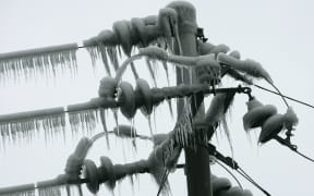 An ice-covered electricity pole in Guangzhou province, China.