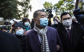 Hong Kong media tycoon Jimmy Lai (centre) arrives at the Court of Final Appeal in Hong Kong on December 31, 2020.