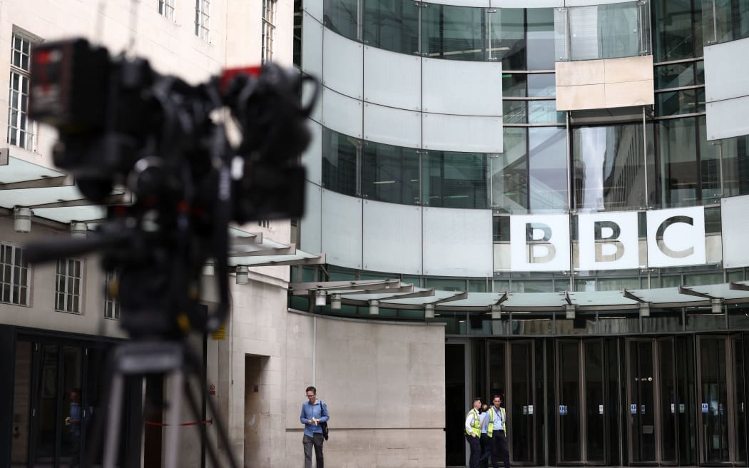 Security guards patrol outside BBC Broadcasting House in central London on July 9, 2023 (Photo by HENRY NICHOLLS / AFP)