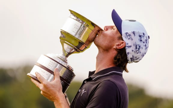 Kristoffer Broberg of Sweden holds the trophy after winning the KLM Golf Open in Cromvoirt, on September 19, 2021. - The 101st edition of the international golf tournament was played for the first time on the Bernardus Golf course.