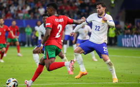 HAMBURG, GERMANY - JULY 5: Nelson Semedo of Portugal and Theo Hernandez of France during the UEFA EURO 2024 quarter final match between Portugal and France at Volksparkstadion on July 5, 2024 in Hamburg, Germany .240705_SEPA_07_062 - 20240705_PD18376 (Photo by Severin Aichbauer / APA-PictureDesk / APA-PictureDesk via AFP)