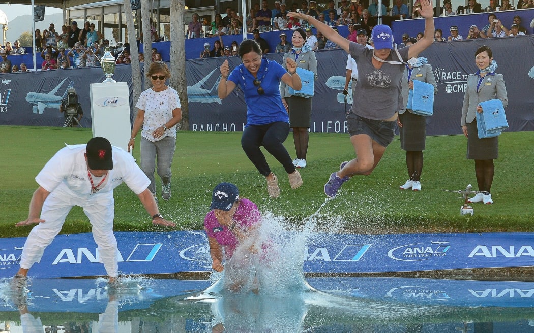 In happier times Lydia Ko and her former caddie Jason Hamilton and Ko's sister celebrate her win at the ANA Inspiration in California earlier this years.