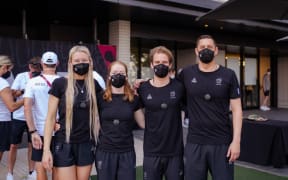 NZ Surfing Olympic team: Ella Williams, team physio Michelle Rellis, Billy Stairmand, and coach Matt Scorringe
