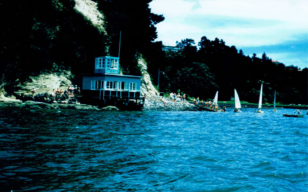 Original Blockhouse Bay Yacht Club with newly erected starting tower, Te Whau Point, Blockhouse Bay Beach, 1956.