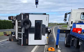 A caravan has flipped, blocking the southbound lane of the Hawke's Bay Expressway near the Pākōwhai/Links Road roundabout.