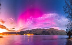 In Wānaka, Cody Tiger Gray shot this image of the aurora over the lake as dawn broke on 12 October 2024.