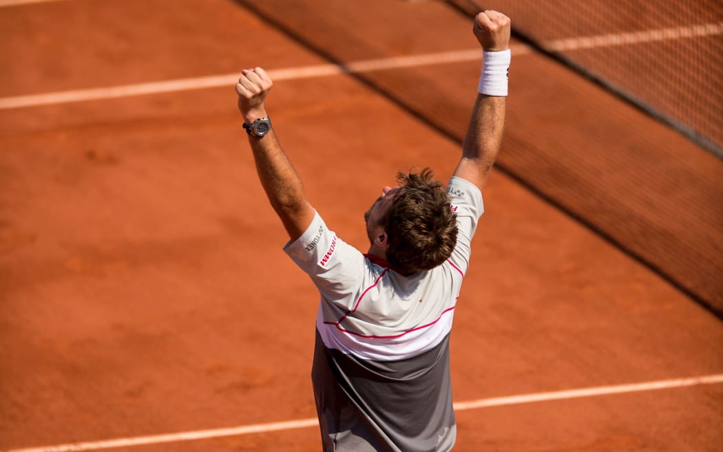 Swiss tennis player Stan Wawrinka celebrates win at French Open 2015.