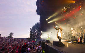 People attend the concert of Svein Berge and Torbjorn Brundtland, from the Norwegian electronic music duo Royksopp, during the Slottsfjell festival in Tonsberg on July 14, 2011.