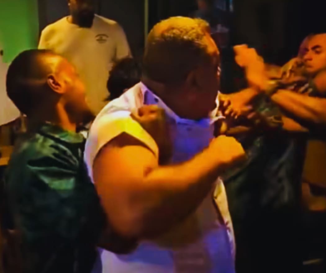 Sevuloni Naucukidi, centre, can be seen throwing punches as bar staff try to contain him.