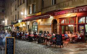 LYON, FRANCE- AUGUST 21, 2018: Bouchon -traditional local restaurant in Lyon where you eat specialties from Lyon and the region. There are 30 Bouchons in Lyon, France.
