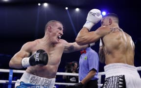 SYDNEY, AUSTRALIA - JULY 16: Paul Gallen punches Sonny Bill Williams during their heavyweight bout at Qudos Bank Arena on July 16, 2025 in Sydney, Australia. (Photo by Darrian Traynor/Getty Images)