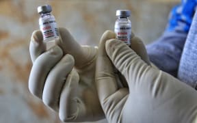A medic show used bottles of COVID-19 vaccines  during the Bharat Biotech's 'Covaxin' human trial after it was approved by the Indian Council of Medical Research (ICMR), at Maharaja Agrasen Super Speciality Hospital in Jaipur, Rajasthan,India, Friday, Dec. 18, 2020.