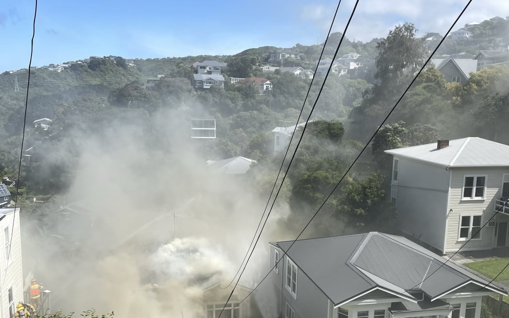 Smoke coming from a house in Kelburn.