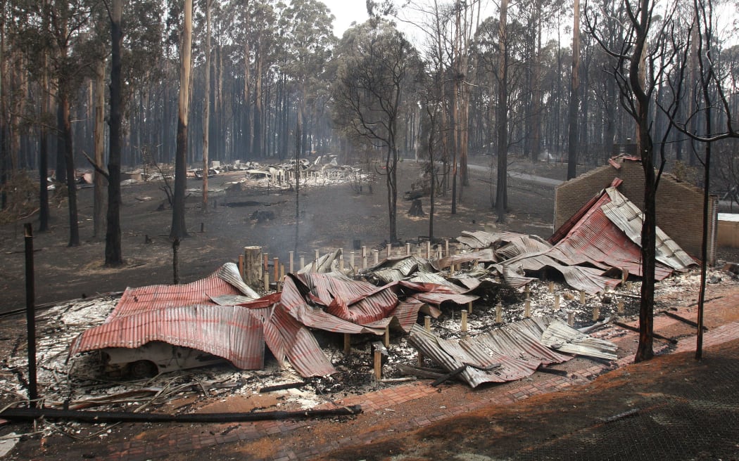 Burnt out houses smolder at Kinglake after the Black Saturday bush fires.