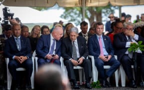 Luxon and Peters talk at Waitangi.