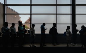 Job seekers wait to enter an auditorium for a job fair in Chicago on June 26.
Mandatory Credit:	Jamie Kelter Davis/Bloomberg/Getty Images via CNN Newsource