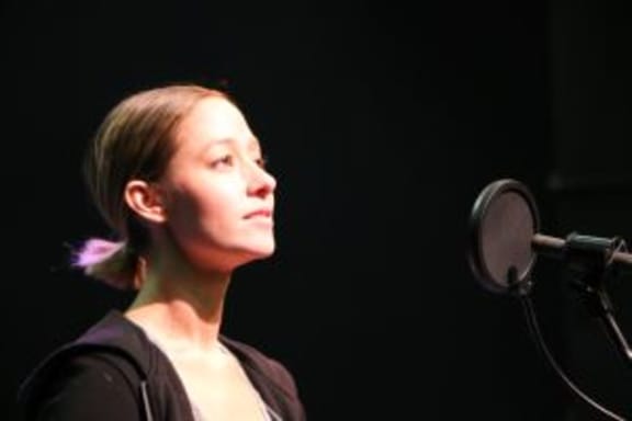 Grace at the mic in My Own Darling