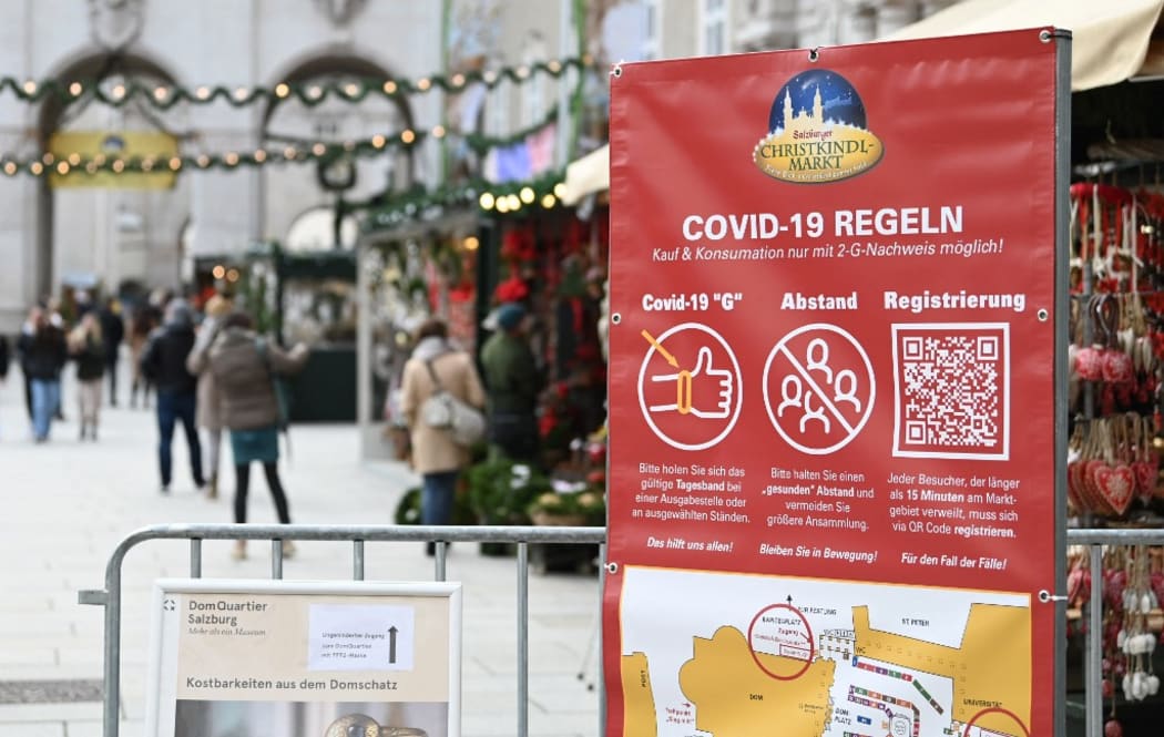 A sign displays Covid-19 health rules at a Christmas market in Salzburg, Austria.