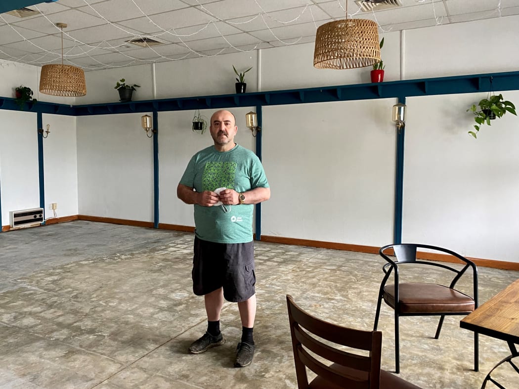 Mustafa Kokcu in Picco Eatery, which was targeted by ram raiders before the water started flooding in.