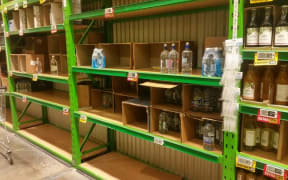 Empty water bottle shelves in Napier