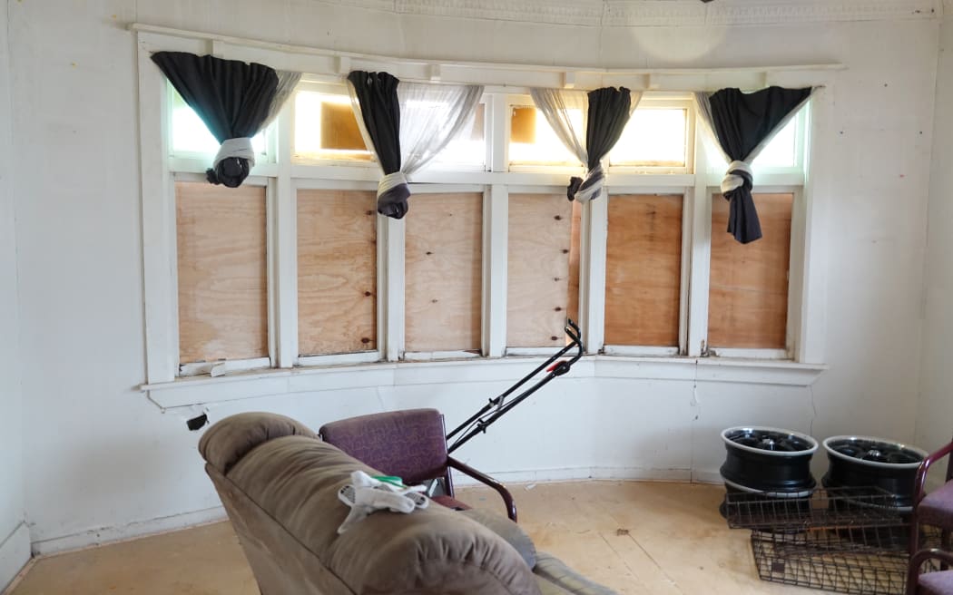 The Fonoti family's front room is boarded up and drafty.