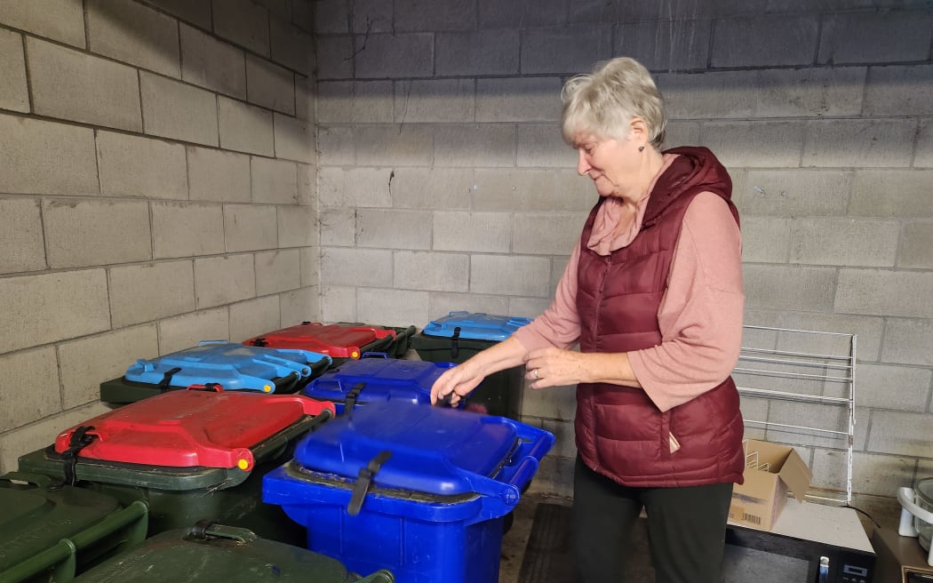 Betsy Kettle, one of the drivers of the City to Farm project, checks out one of the specially adapted food scrap bins at Ryman's Evelyn Page Retirement Village
