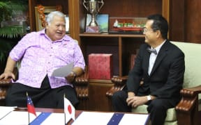 Prime Minister Tuilaepa Sailele Malielegaoi and the ambassador of Japan,
Maugaoleatuolo Shinya Aoki.