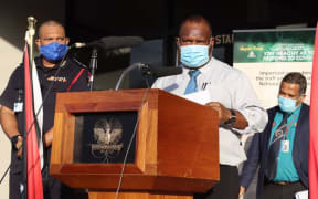 PNG's Pandemic Response Controller David Manning (left), Prime Minister James Marape (centre) and Acting Health Secretary Paison Dakulala (right).