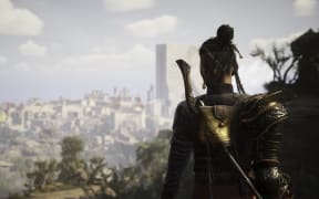 A character from the video game Flintlock produced by New Zealand video game studio A44 looks over a city.